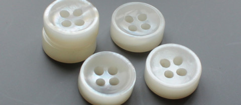 double white MOP shell buttons with concave face